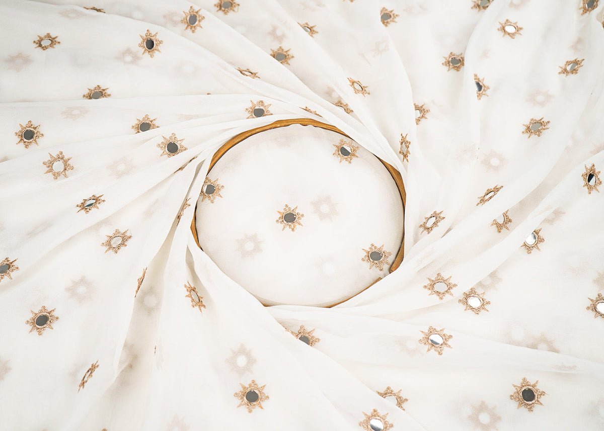 White Georgette Dyeable Fabric With All Over Buti Of Golden Zari And Faux Mirror Work PG 22409 - Design For Destiny